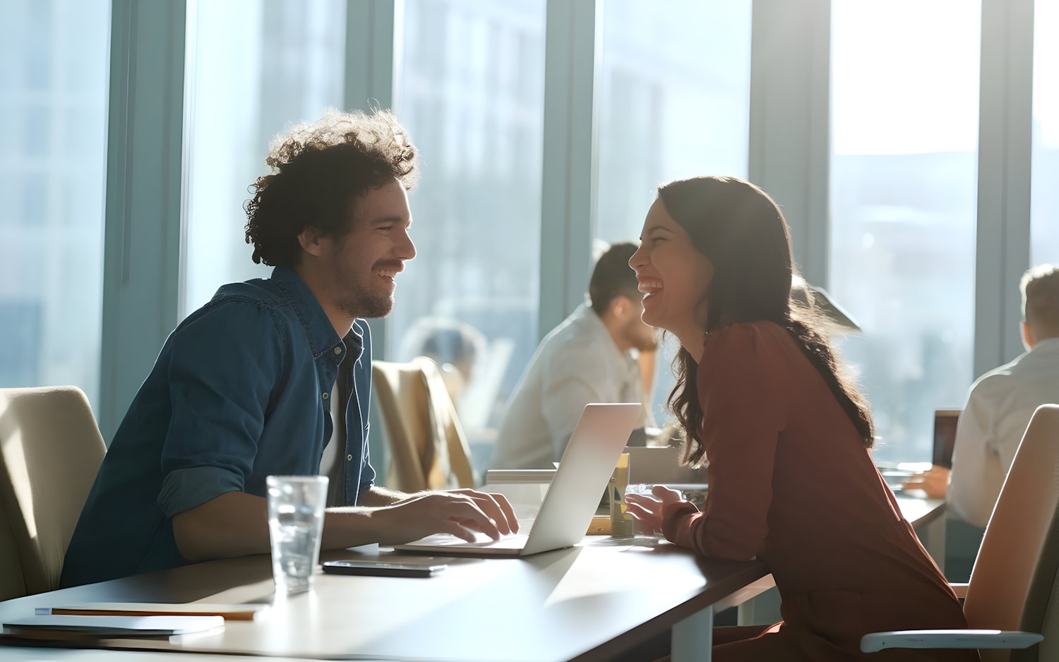 A professional sales job interview in progress, showing a candidate engaging with an interviewer, highlighting the importance of preparation.