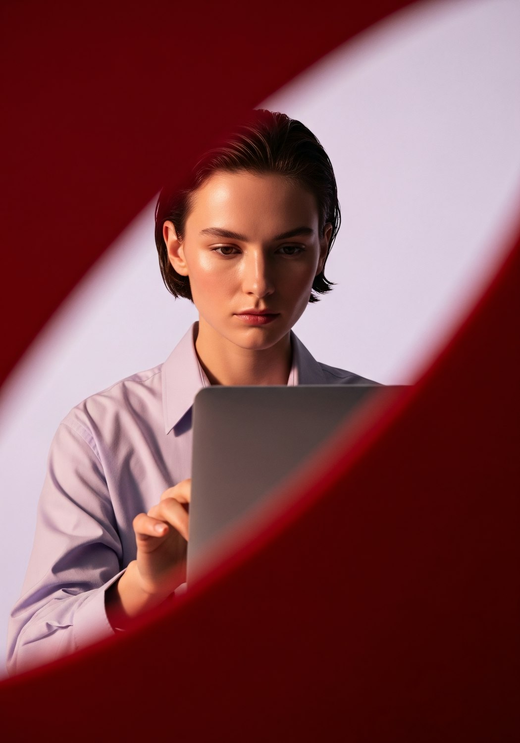 A person intently focusing on an online course or tutorial on a computer, representing skill enhancement.